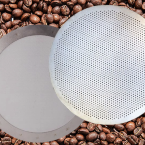 Two stainless steel Aeropress reusable filters, the disk and mesh type, with coffee beans in the background