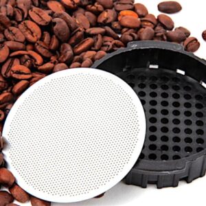 Stainless steel disk AeroPress coffee filter leaning against filter basket with pile of coffee beans – reusable, eco-friendly